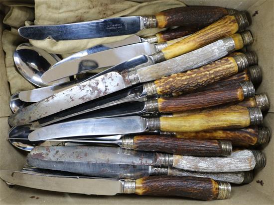 Thirty assorted early 20th century antler handled table knives and dessert knives, with silver collars and handle terminals etc